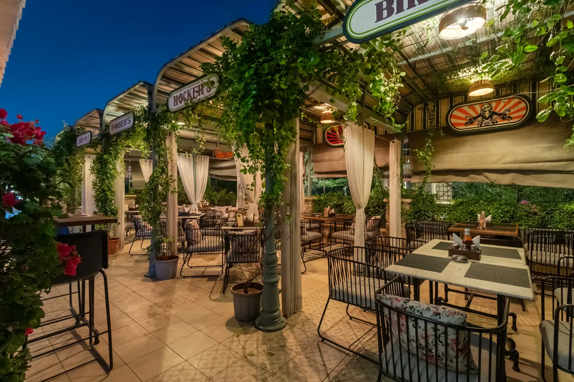 Garden seating on the terrace under a blue evening sky